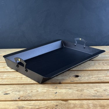 Netherton Foundry Prospector Roasting Tray. Can be used on large suitably sized induction hobs. To keep tray flat, on all heat sources (especially induction), heat up slowly at first, and don't drop hot trays into cold water.